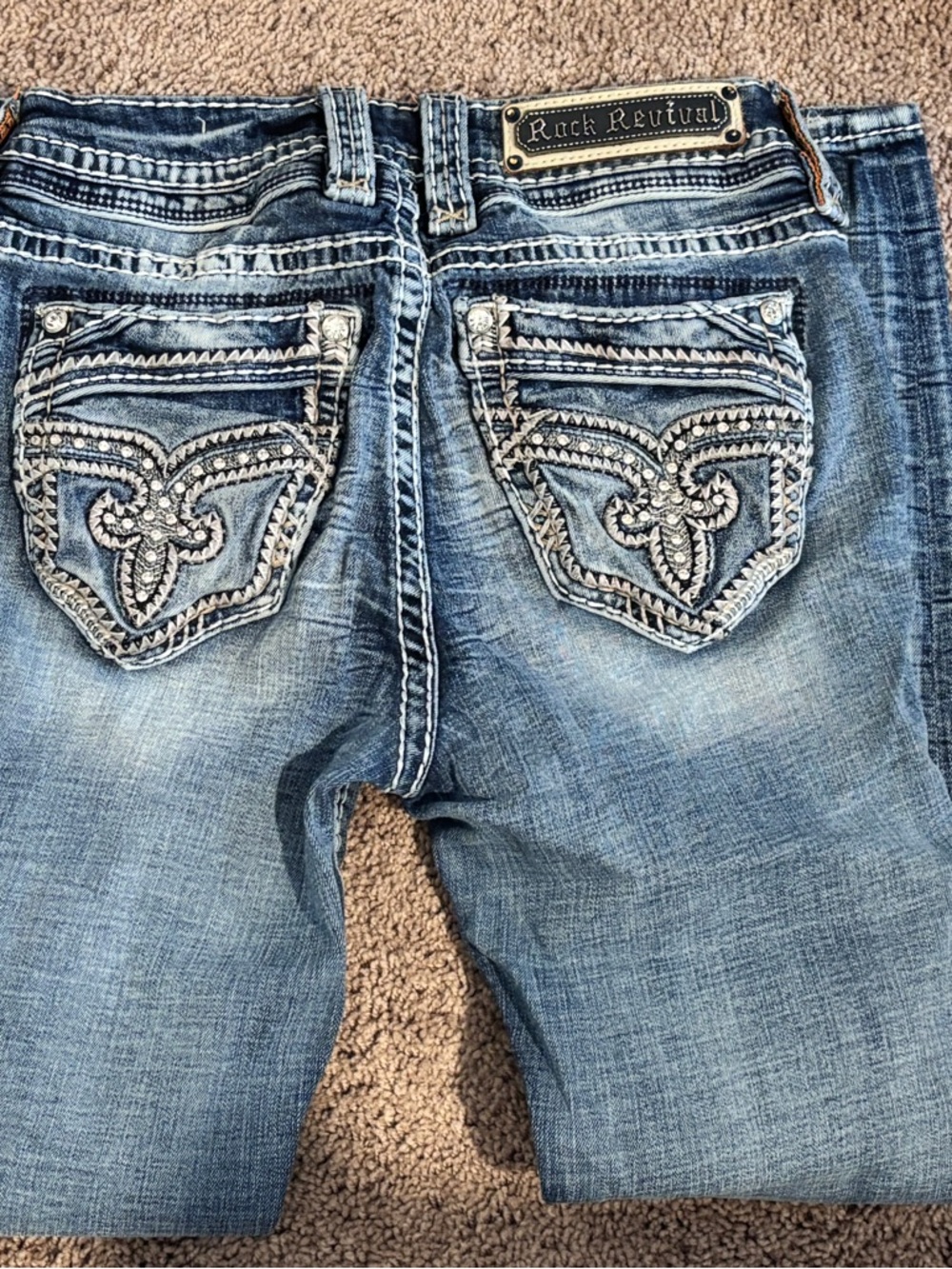 Rock Revival Distressed Light Blue Boot-Cut Jeans with Embroidered Pockets